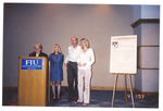 Dr. Suzanna Rose (speaking), Pam, Seth, and Liebe Gadinsky by Women's Studies Center, Florida International University