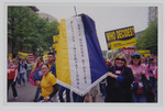 Florida International University students and faculty display the Women's Studies banner during the march by Women's Studies Center, Florida International University