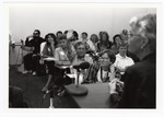 An attendee at the 1990 Women's Studies Colloquium asks a question during a panel discussion by Women's Studies Center, Florida International University