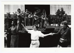 Conference attendees dance during Libana's performance at the 1991 Women's Studies Colloquium by Women's Studies Center, Florida International University