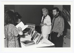 Conference attendees buy books written by keynote speaker Peggy Reeves Sanday by Women's Studies Center, Florida International University