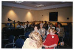 Attendees watch a presentation at the 1997 Women's History Month Conference by Women's Studies Center, Florida International University