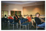 Attendees turn their heads at the 1997 Women's History Month Conference by Women's Studies Center, Florida International University