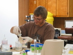 Peter Lenaker preparing water samples for nutrient analysis by Victor H. Rivera-Monroy