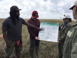 Dr. Justin Cummings presenting his field poster near TS/Ph-1 during the FCE LTER Mid-term Review field trip by Edward Linden